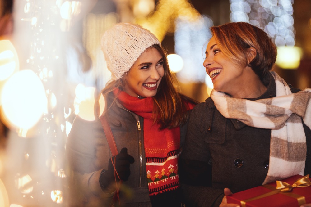 two women in cold weather clothes smiling
